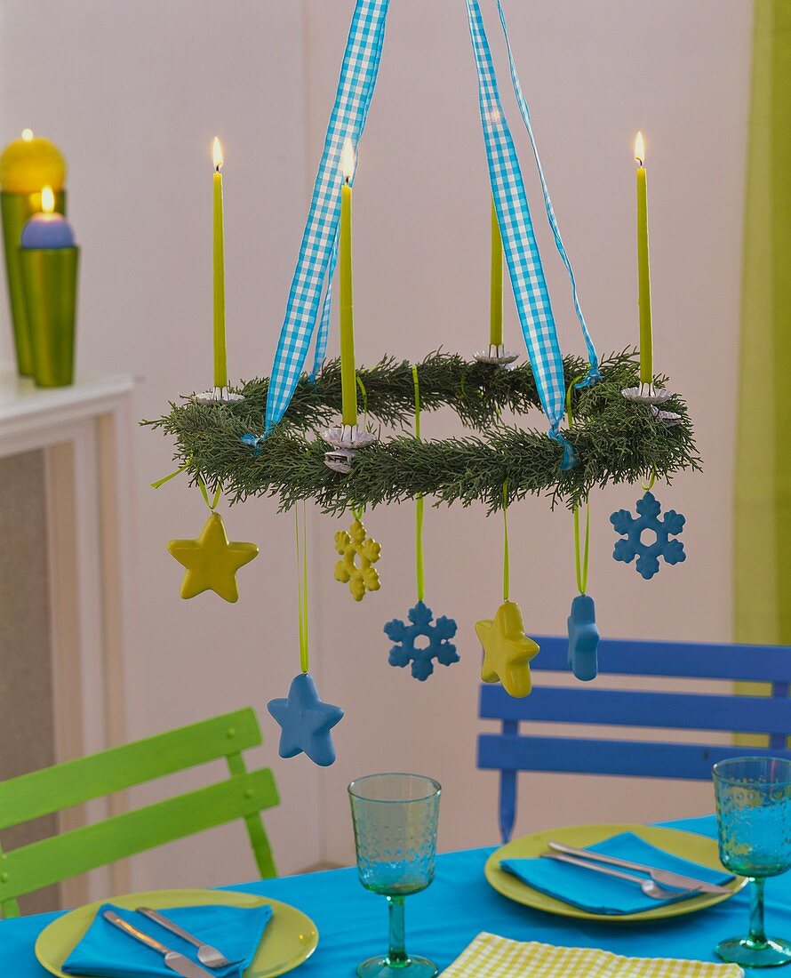Hanging cypress Advent wreath with candles and stars