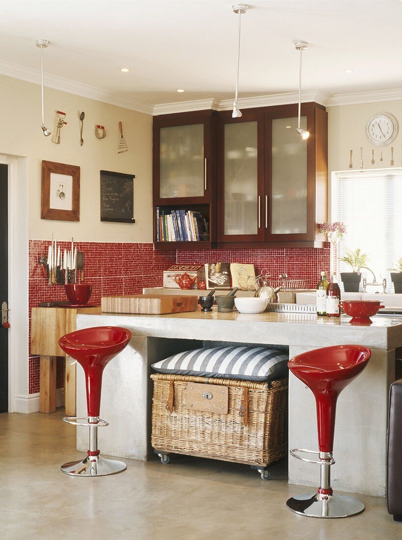 Bar stools in front of a kitchen unit