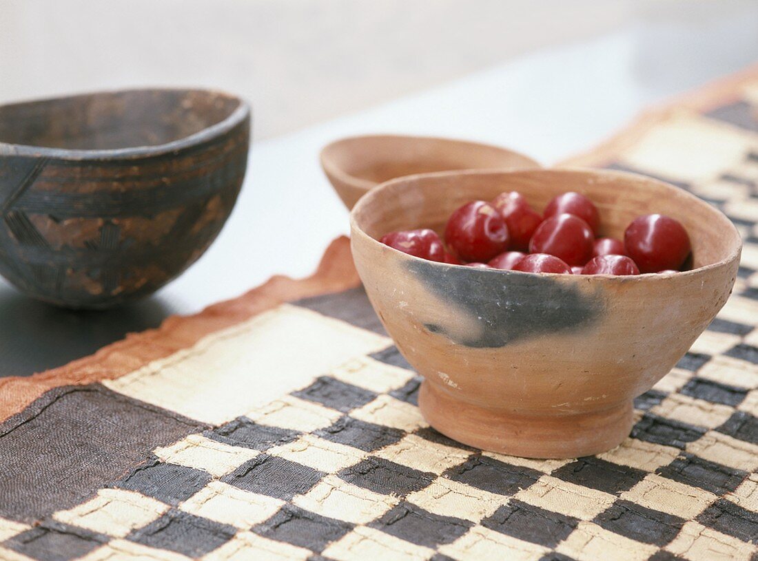 Cherries in a terracotta bowl