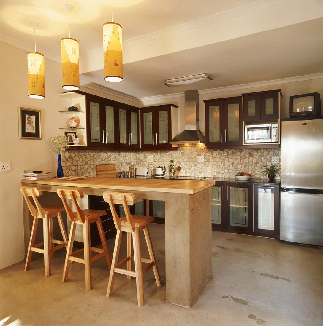 Open-plan kitchen with breakfast bar & bar stools