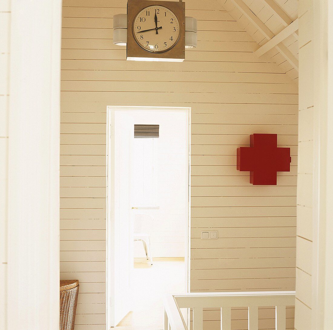 Clock and medicine cabinet on wall