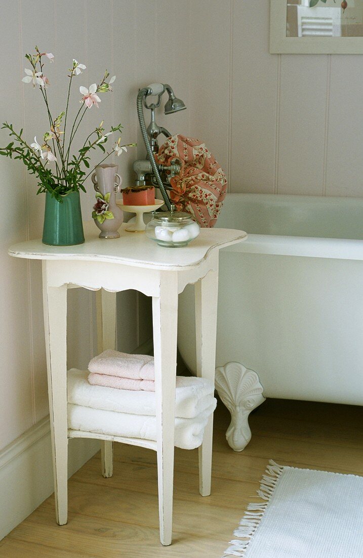 Small table next to bathtub