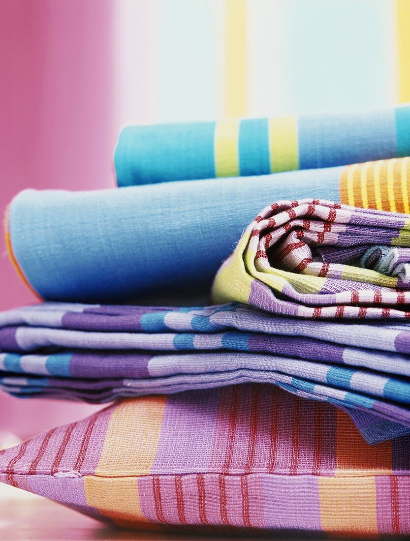 Colourful fabrics and cushions
