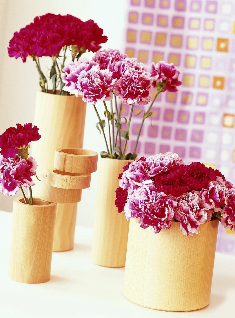 Flowers in wooden vases
