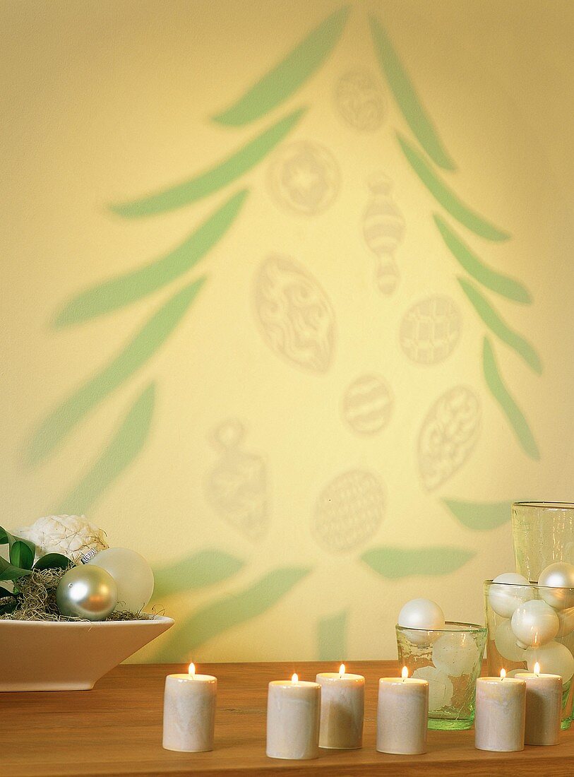 Candles and Christmas tree projected on wall
