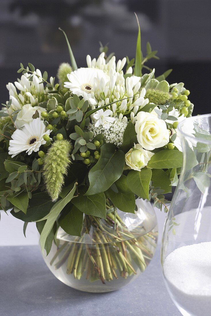 Glass vase of white flowers