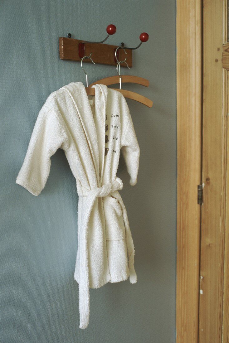 Child's dressing gown on coat rack