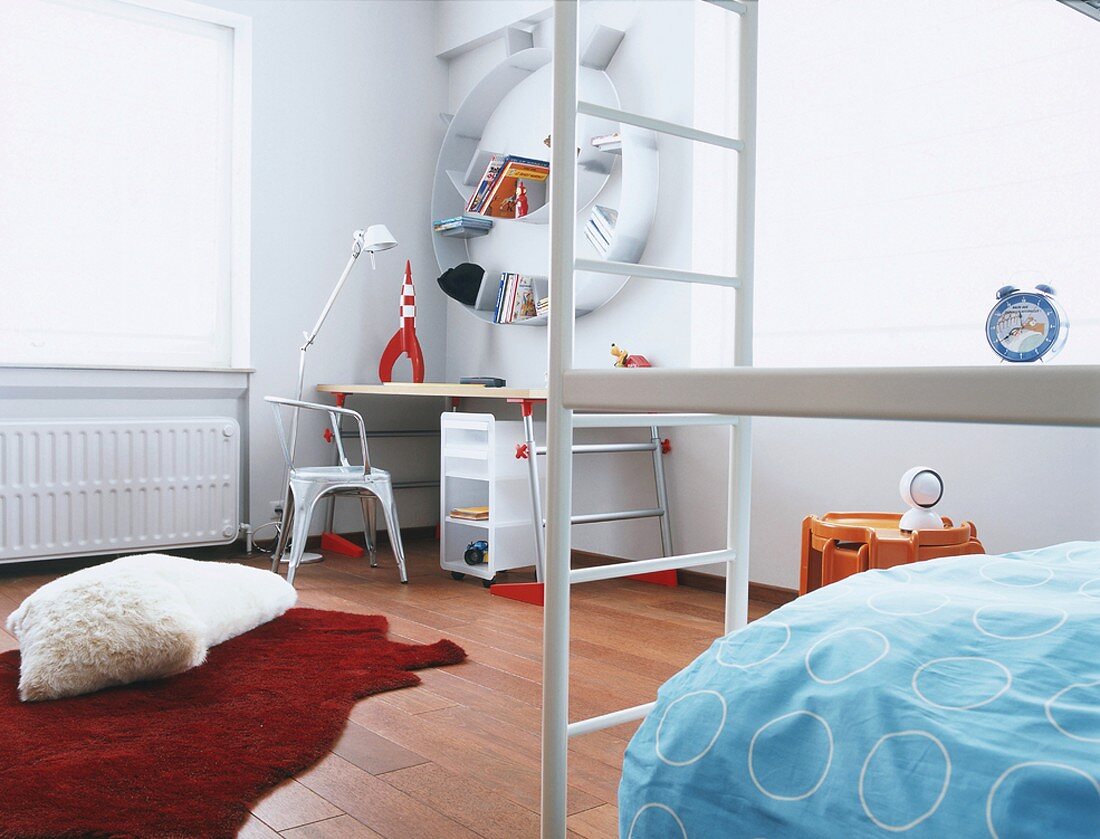 Children's bedroom with bunk beds, desk & circular shelves