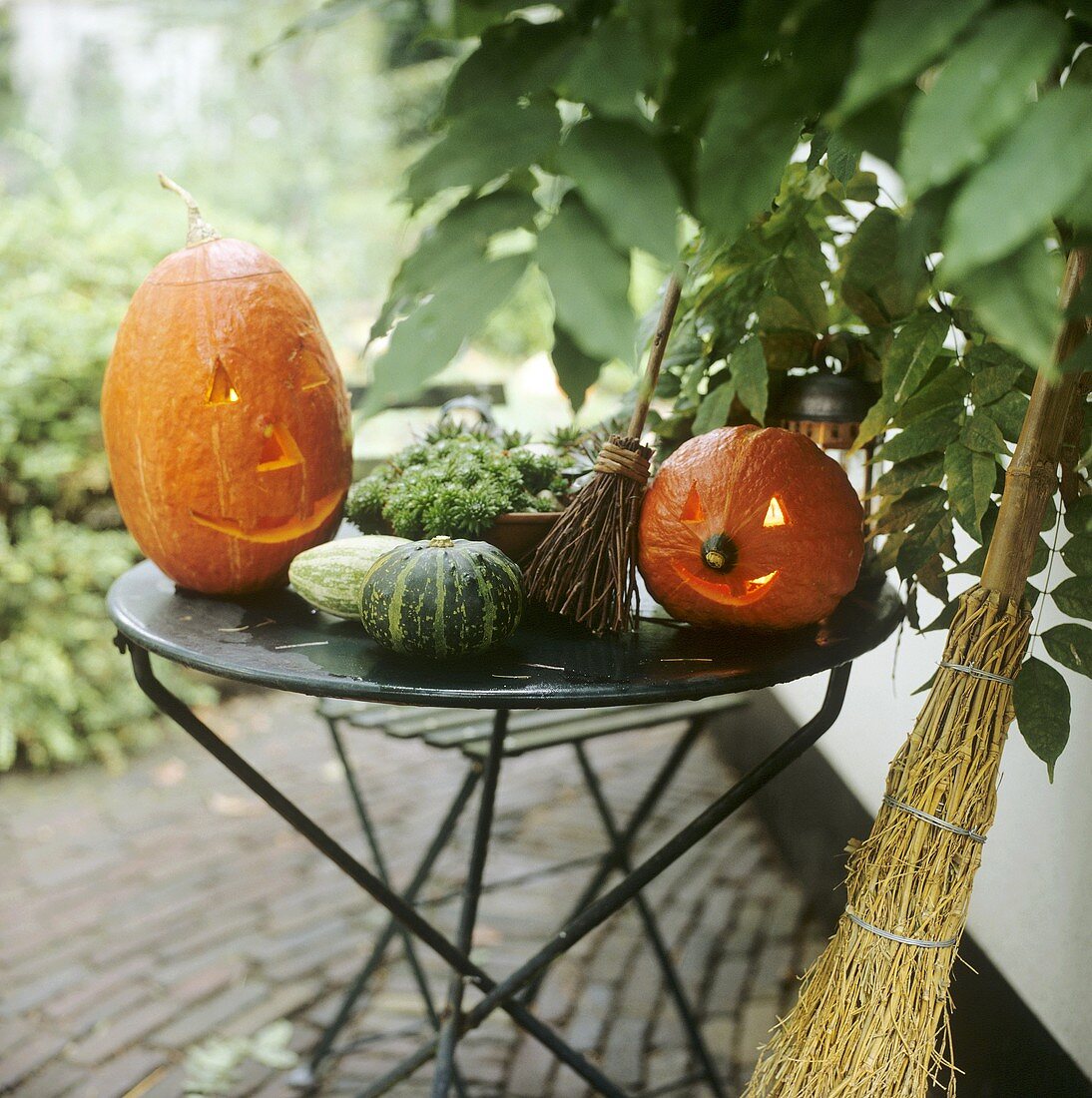 Carved pumpkins and besom broom