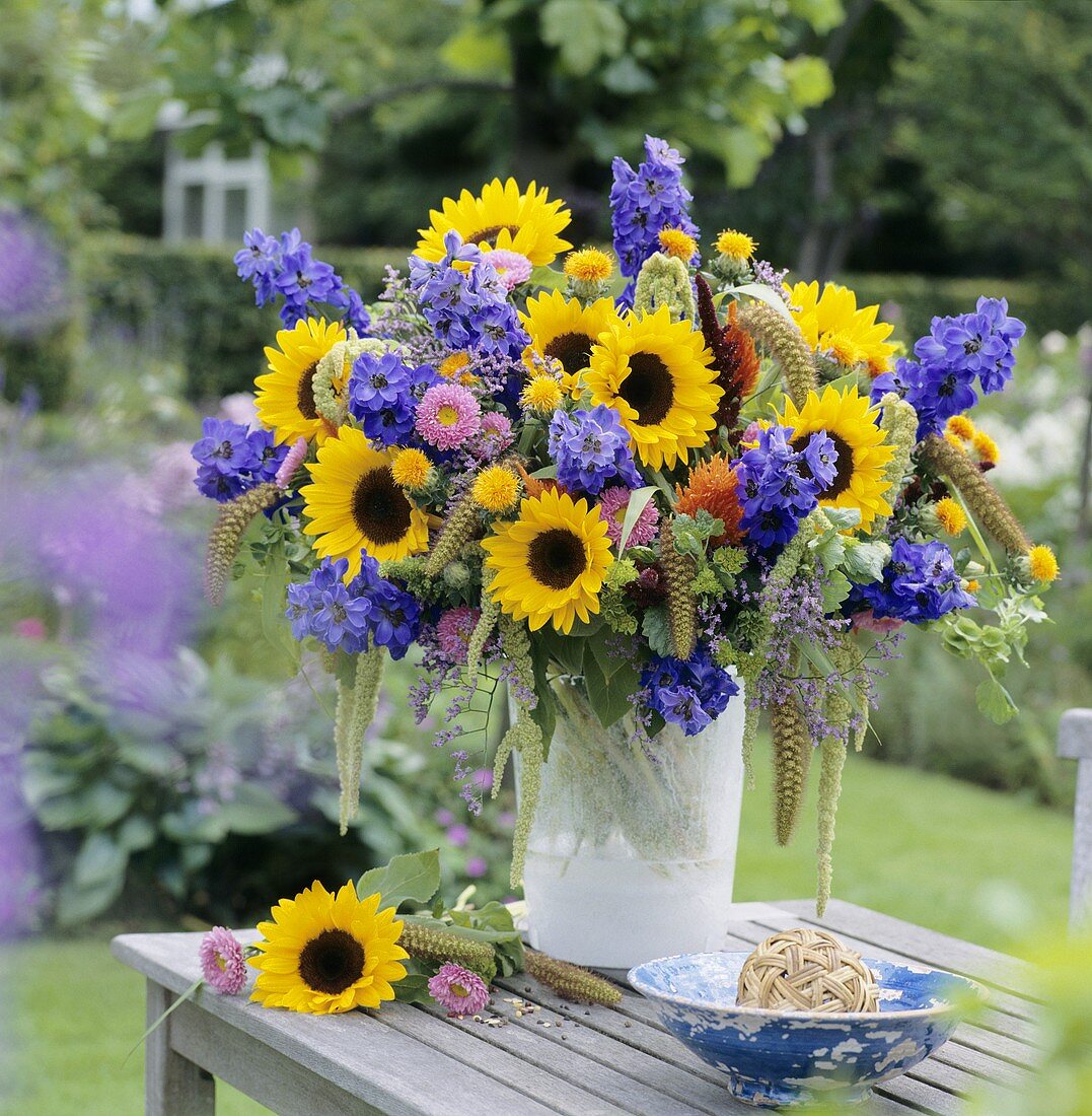 Vase of colourful summer flowers (sunflowers etc.)