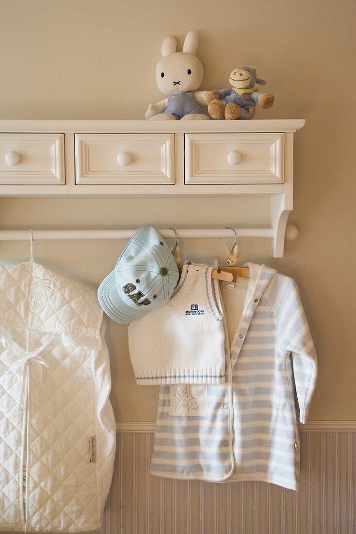 Child's clothing hanging on coat rack