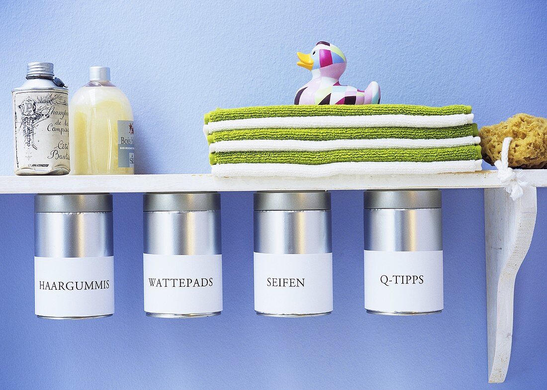 Shelf with labelled storage containers