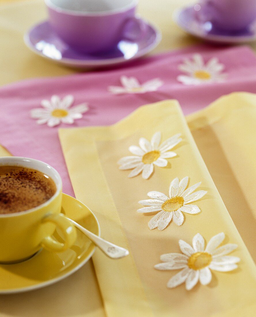 Hot chocolate on table with springtime decorations
