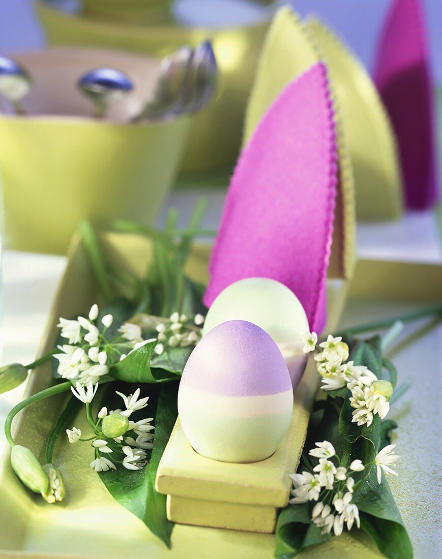 Easter decoration: coloured egg cosies and eggs