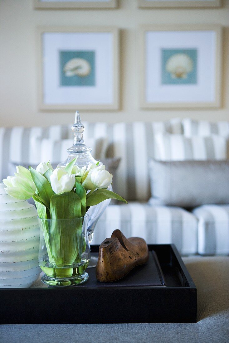 Ornaments, flowers and sofa in sitting room