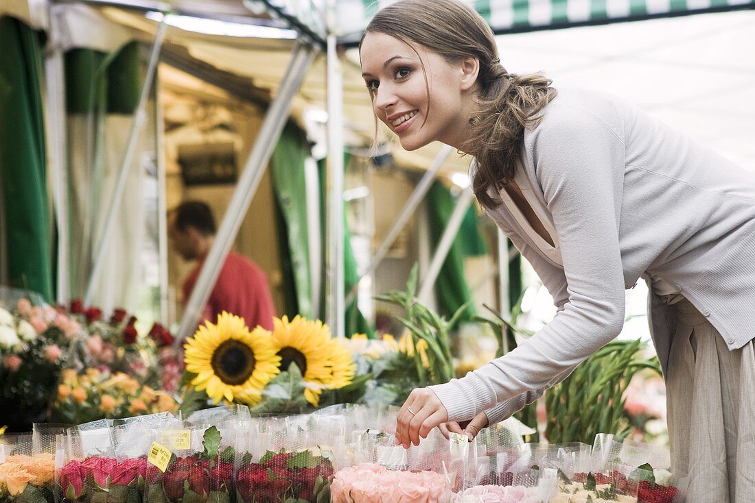 Young woman at a flower market