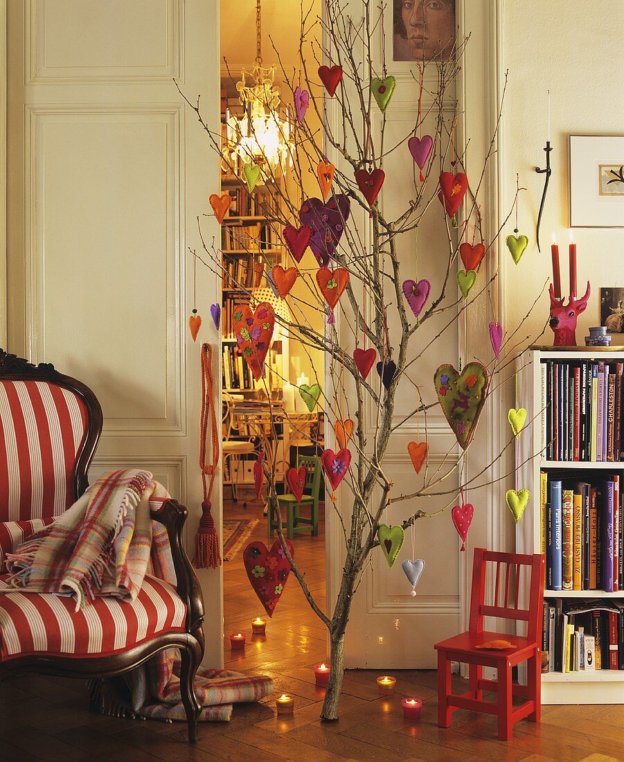 Branch decorated with felt hearts in a living room