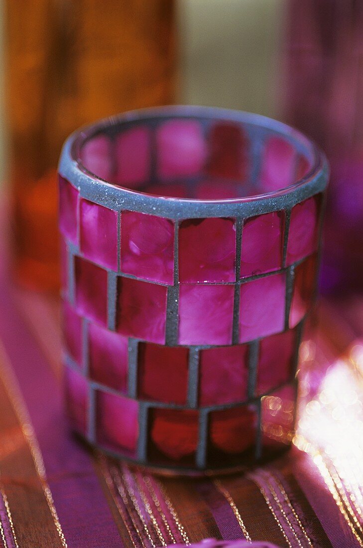 Candle in coloured glass