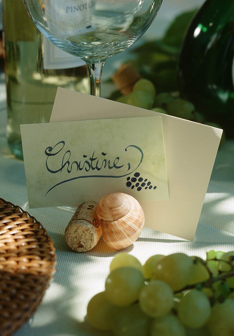 Place cards with snail shells and corks