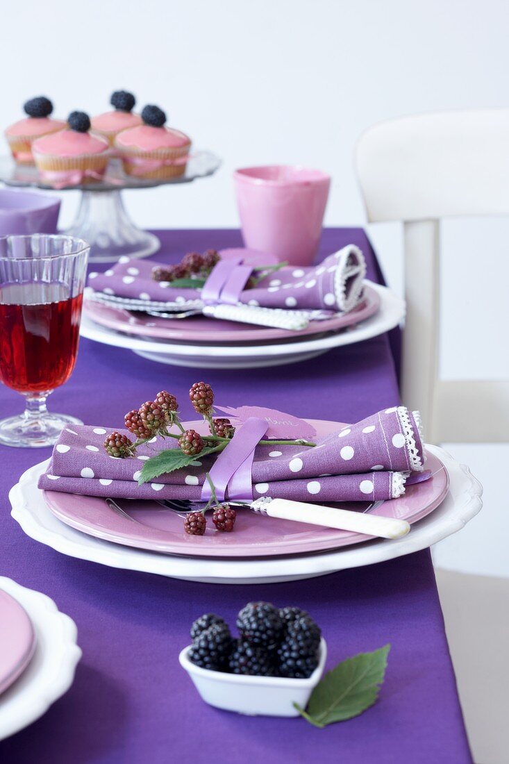 A table laid with blackberries