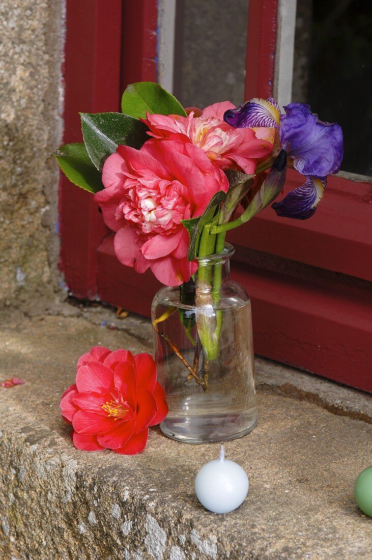 Small posy of flowers on window sill