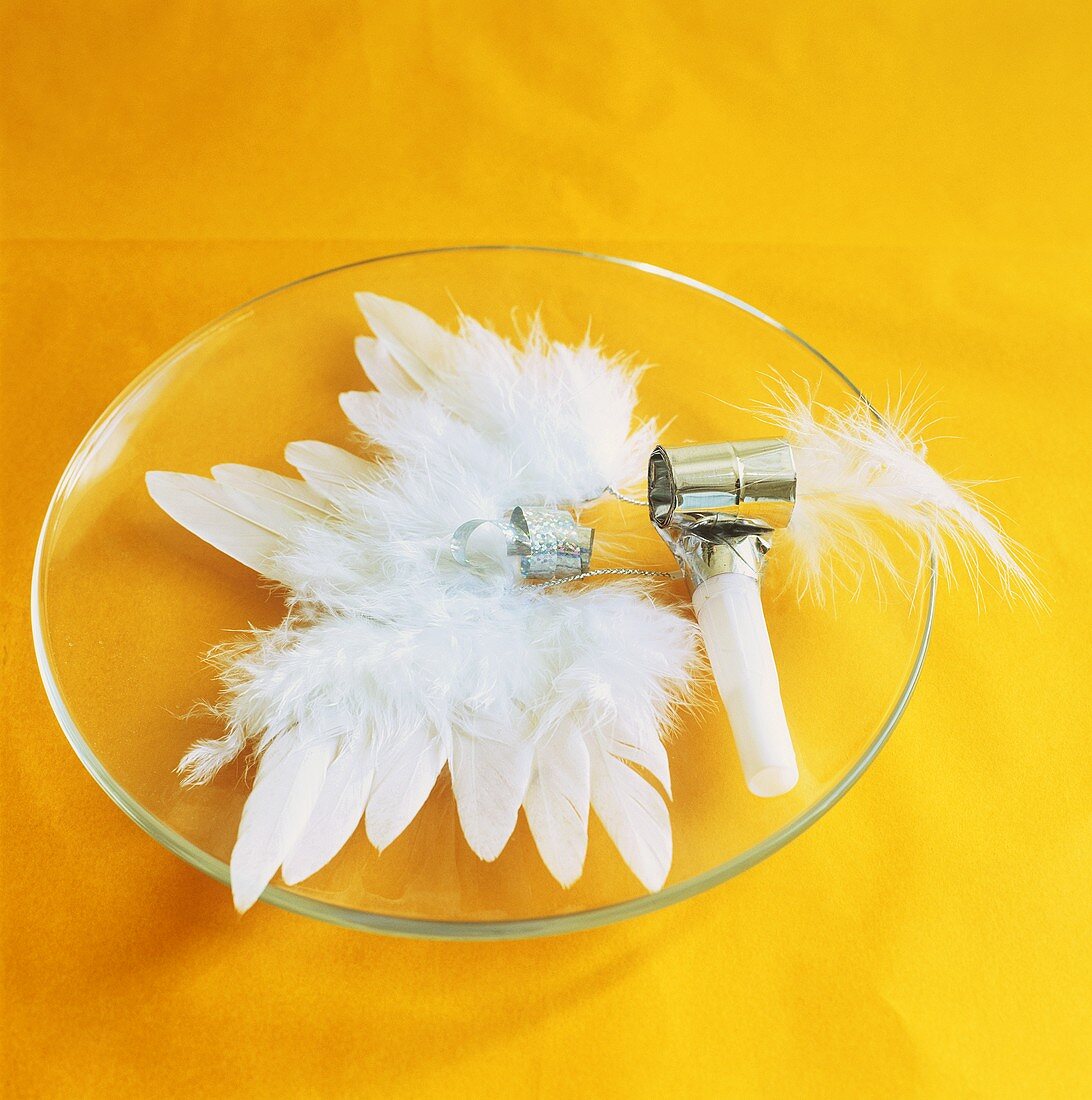 Plate decoration of white feathers and blowout