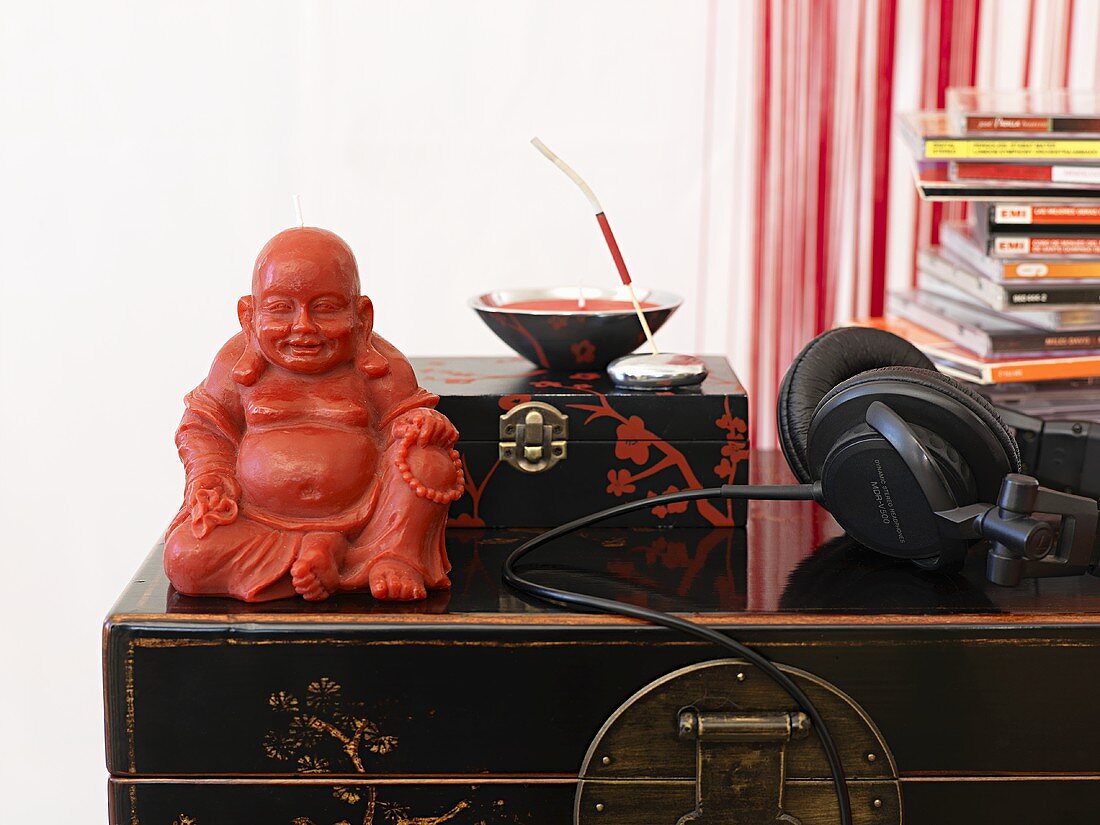 Buddha figure, music CDs and headphones