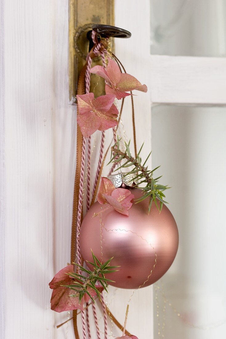 Christmas baubles, juniper and hydrangea flowers