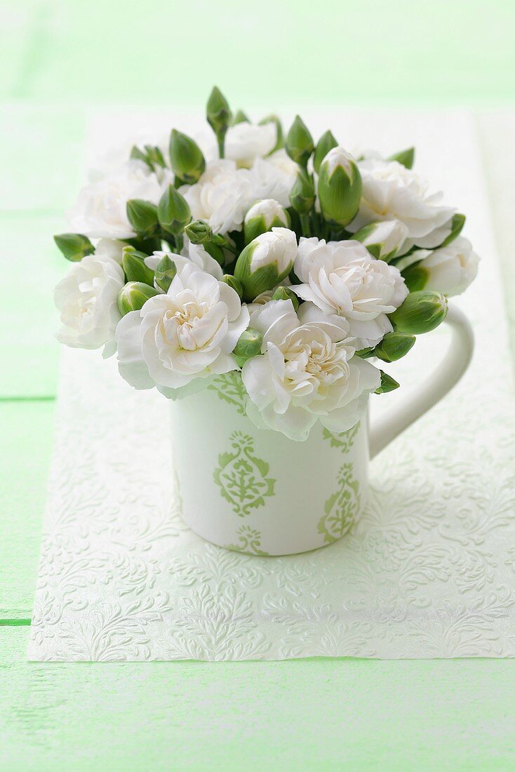 White camellias in a mug