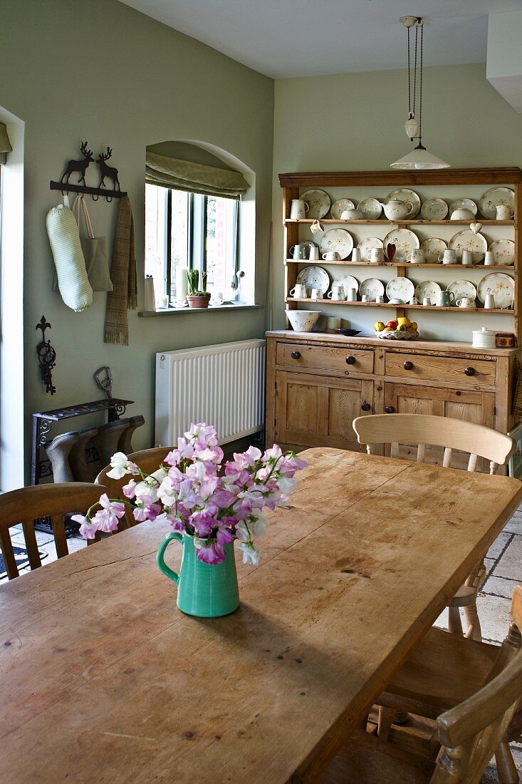Wooden dining table and dresser in kitchen