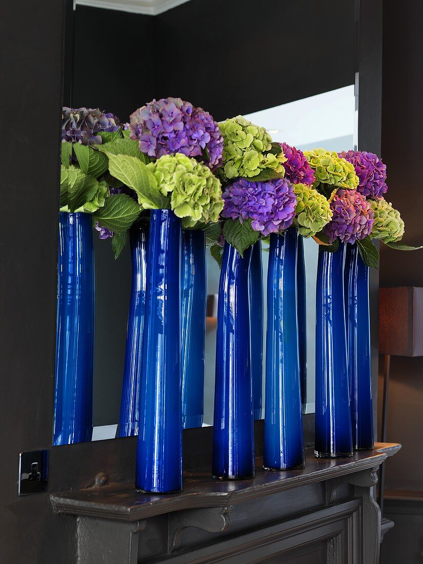 Hydrangeas in blue vases on mantel in Launceston Place (London restaurant)