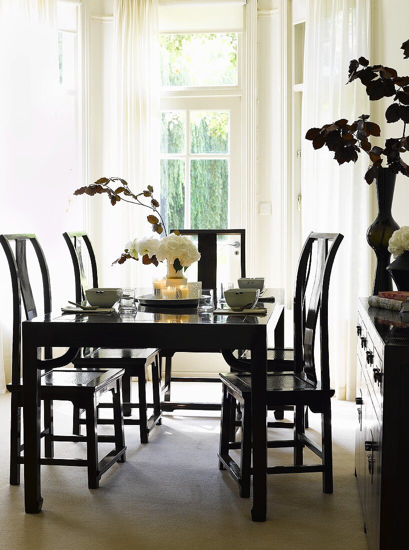 Black dining table, chairs and cabinet