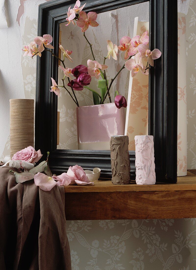 Vases with pink orchids and purple tulips
