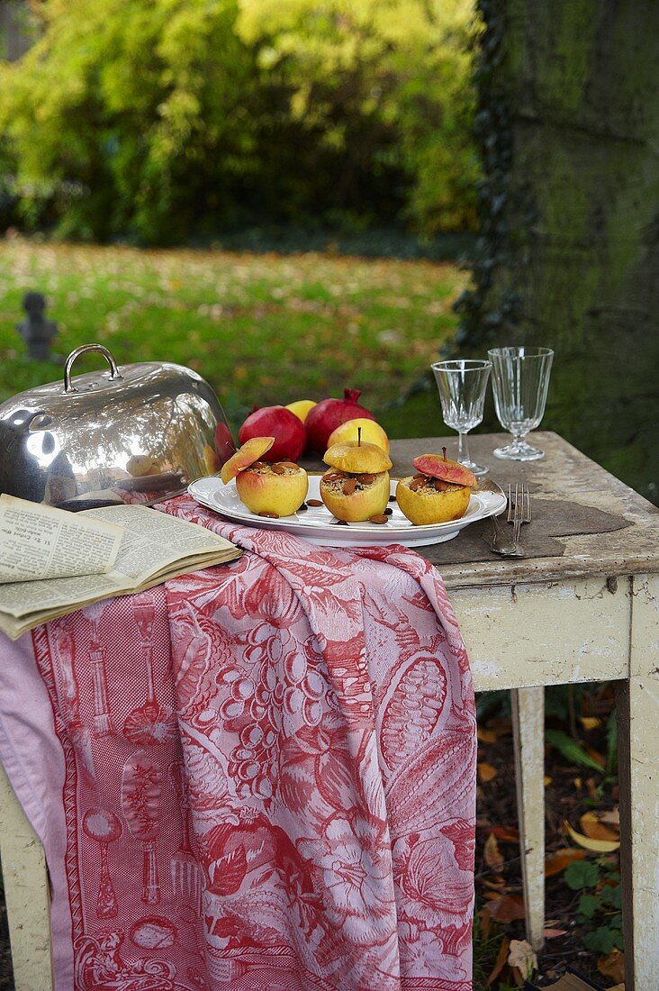 Baked apples on a plate in a garden