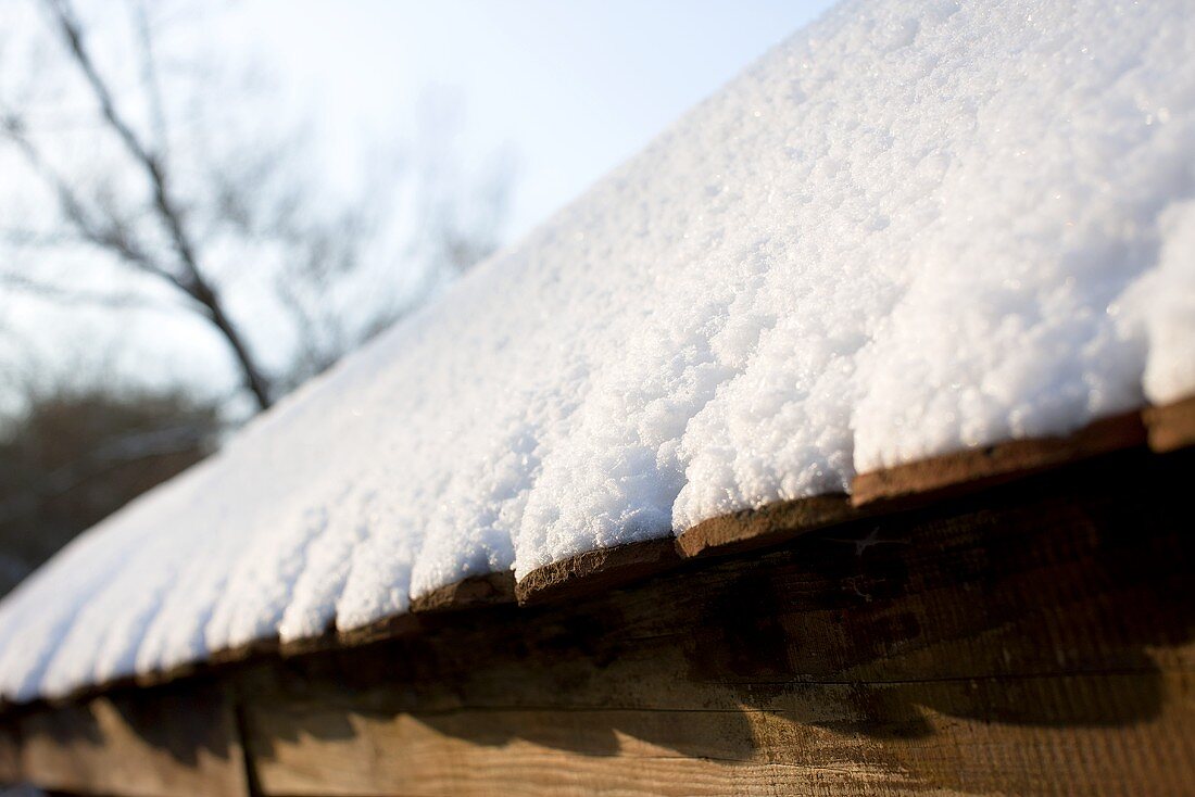 An old roof covered in snow