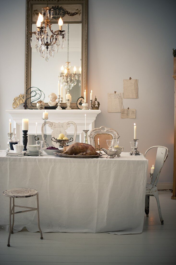 A festively laid Christmas table with roast goose