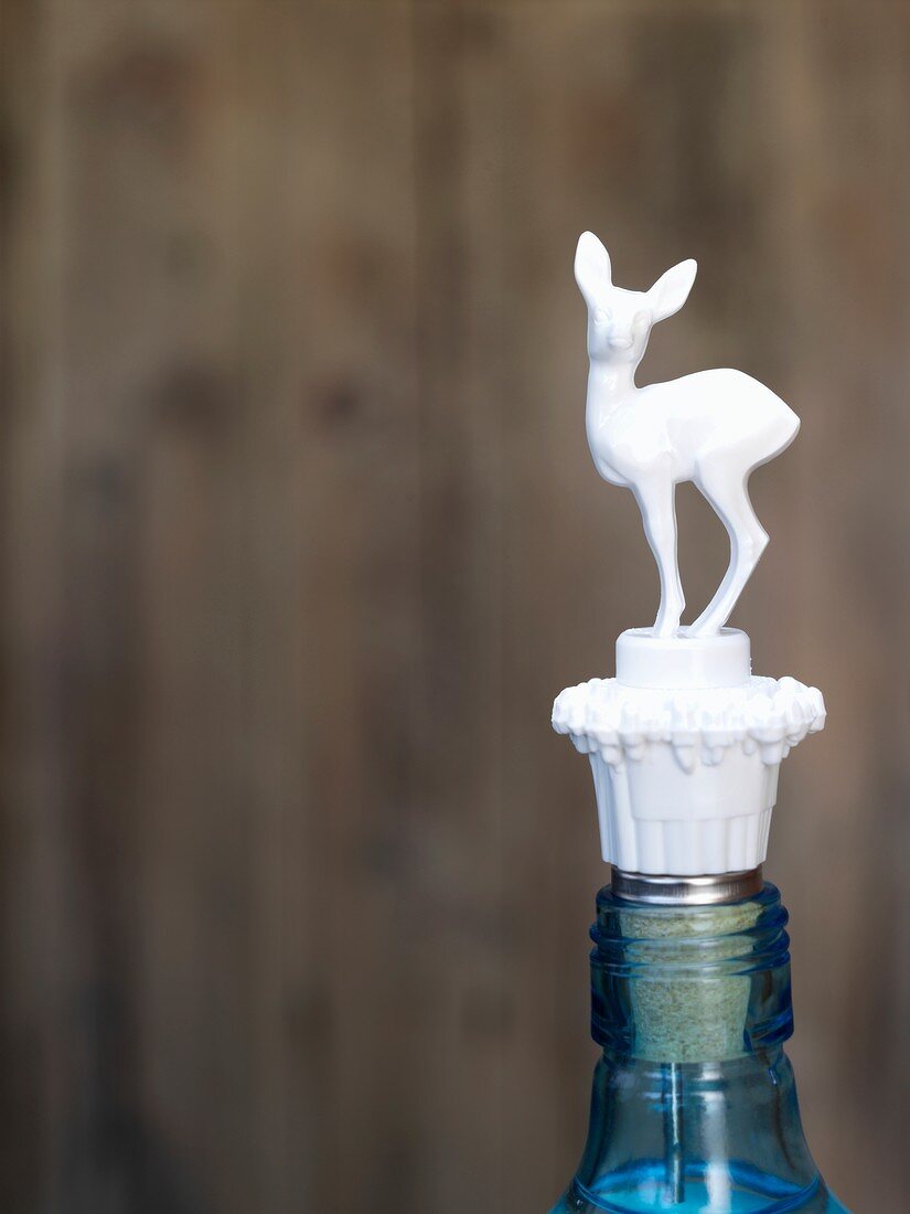 Bottle with a deer-shaped stopper