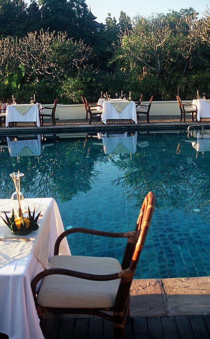 Tables Set Up Poolside at Four Seasons Hotel in Chiang Mia Thailand