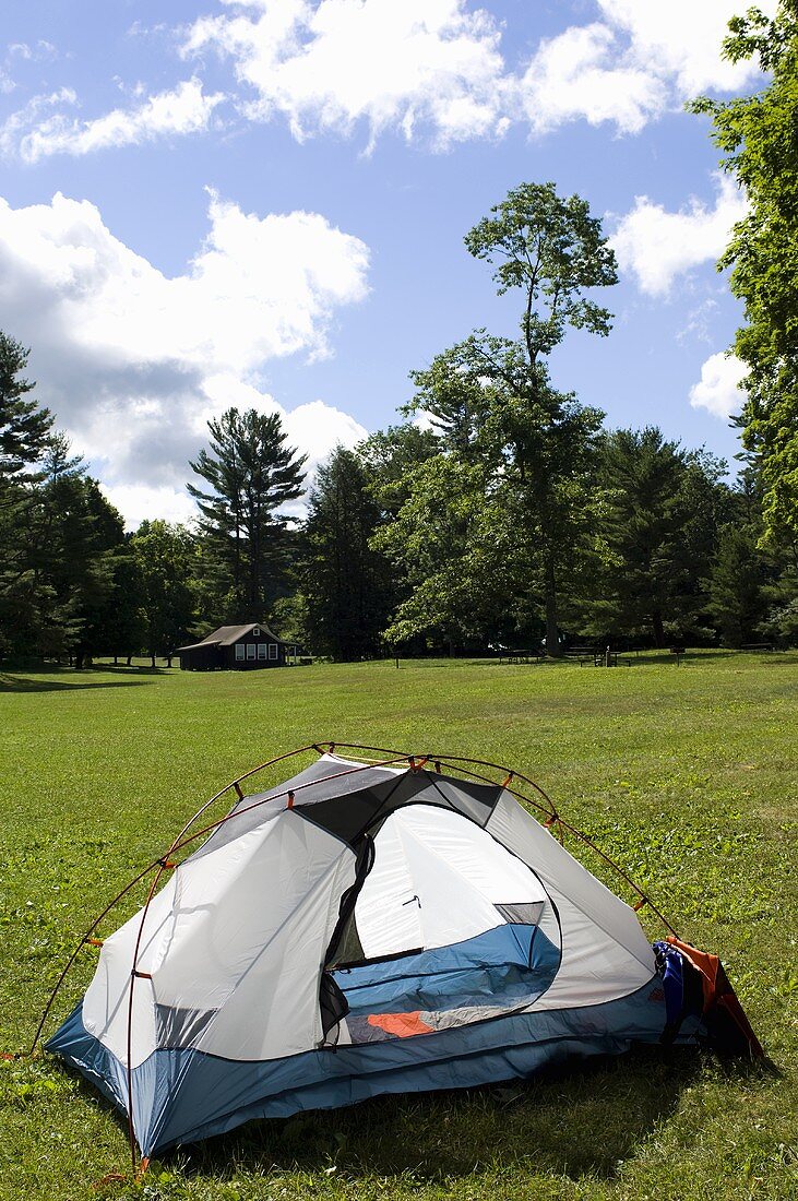A Camping Tent Set up in a Field