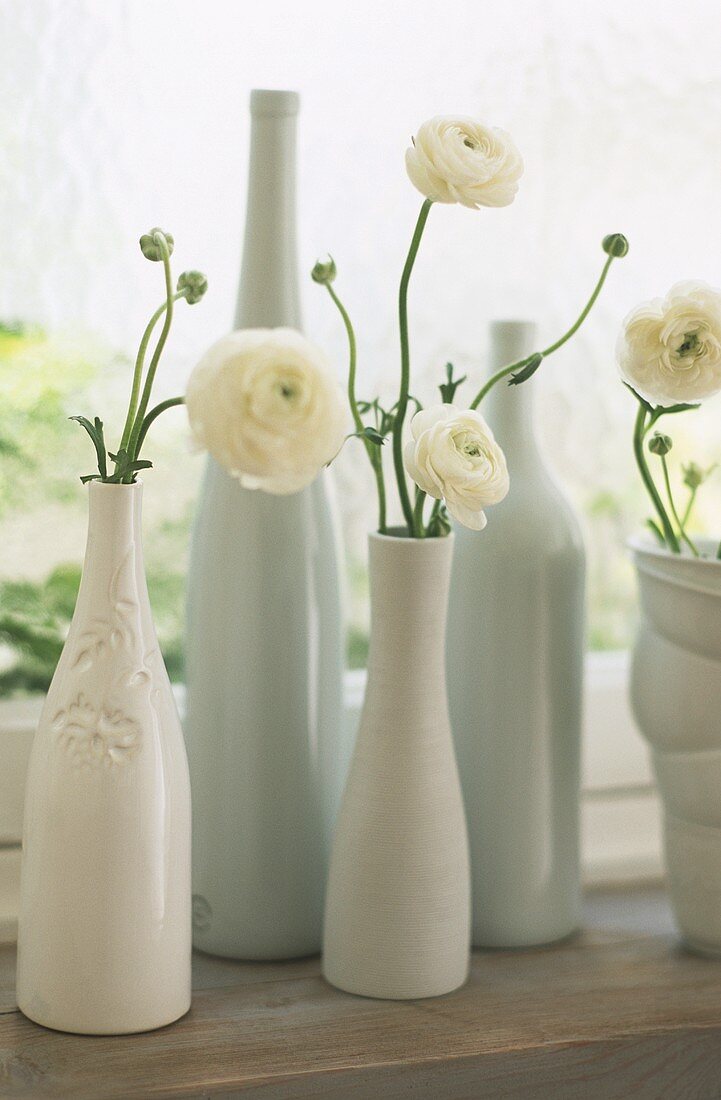 Porcelain vases with white buttercups