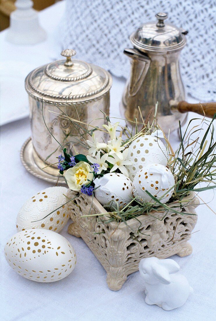 Easter decoration next to silver containers