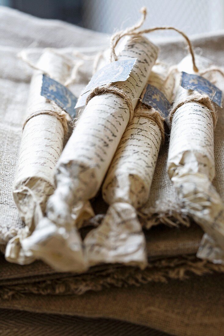 Packages tied with string on linen