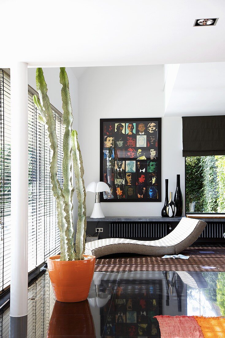 A designer living room with black floor tiles