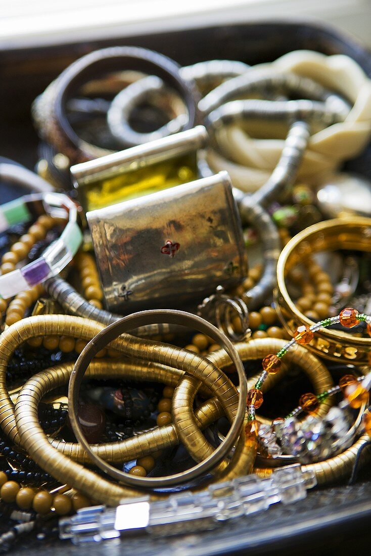 Bracelets and necklaces in a jewellery dish