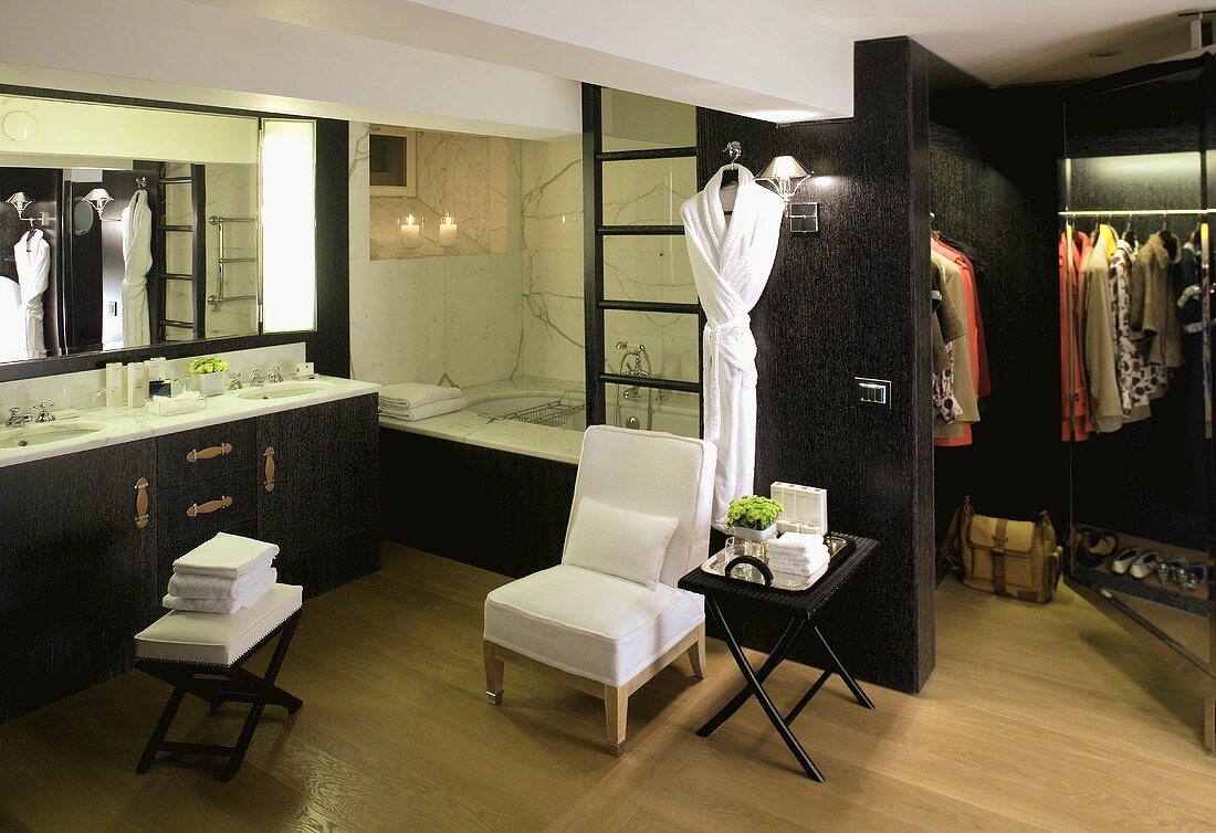 Bathroom and open dressing room clad in black wood