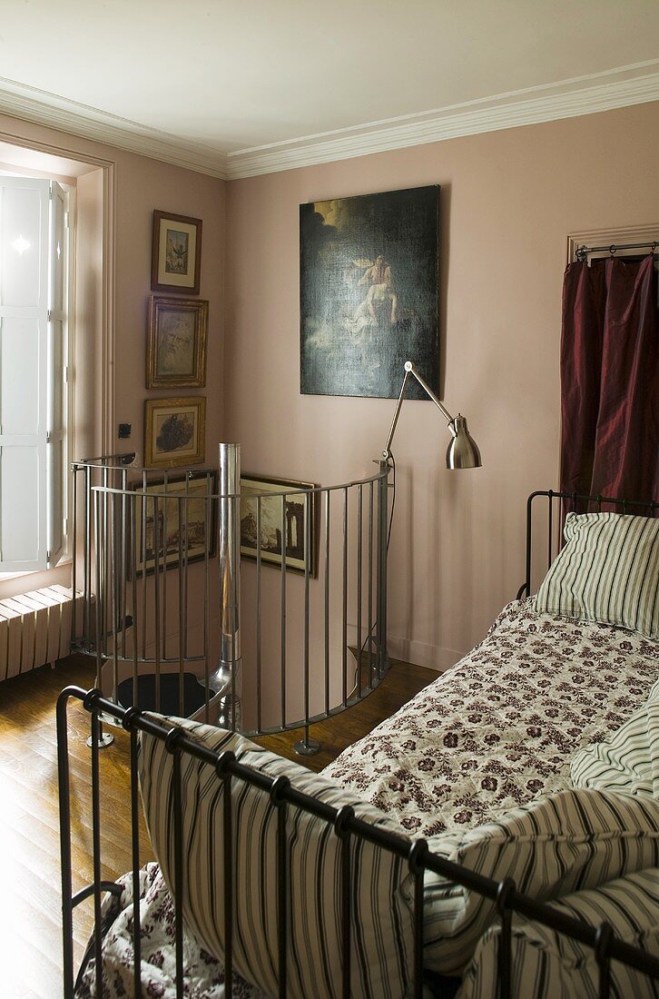 Pink bedroom with spiral stairs