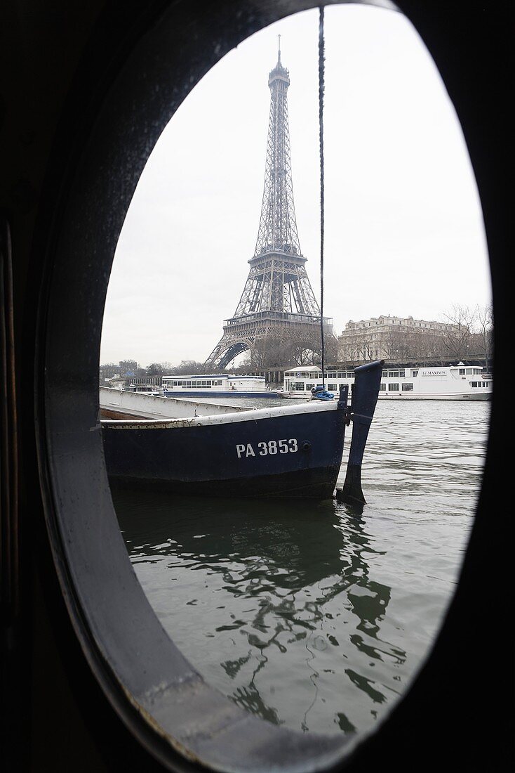 View through a porthole of the Eiffel tower