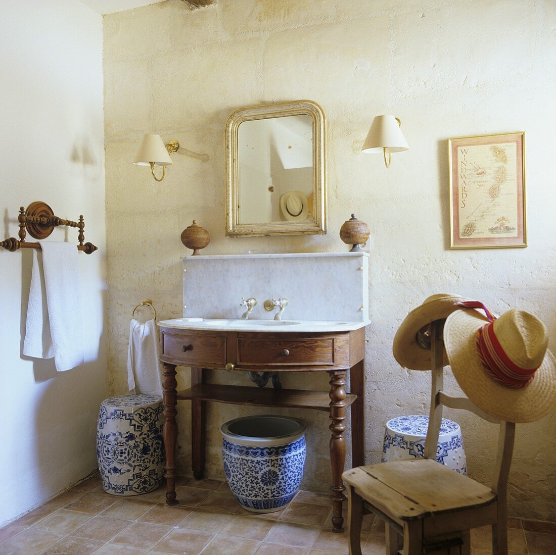 Ceramic jars under a simple washstand in a rustic house