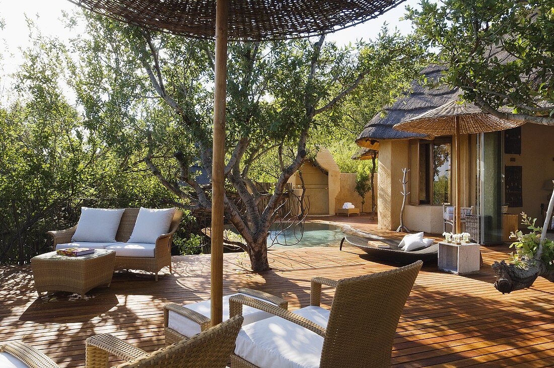 Wicker furniture on a wooden terrace of a South African house