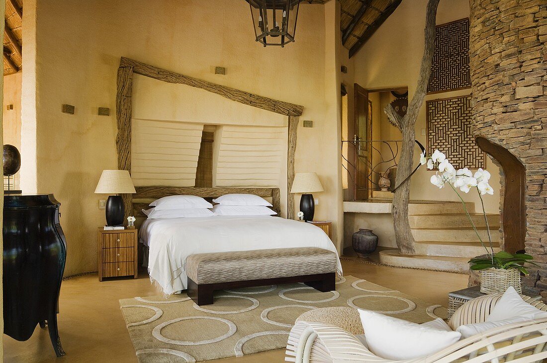 A spacious bedroom with a double bed in a South African house